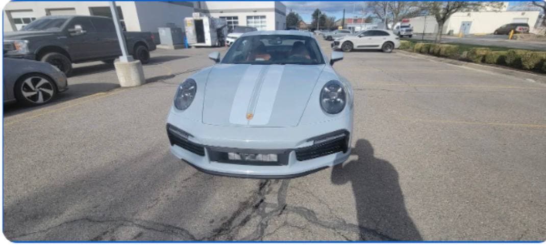 White Porsche at a Salt Lake-area dealership parking lot